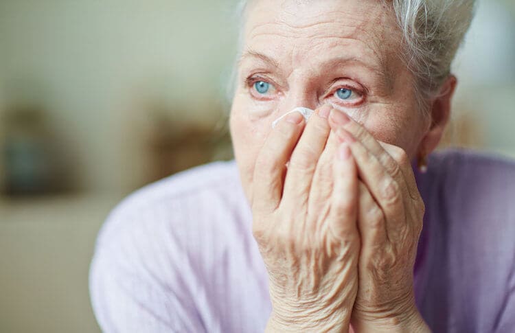 Elder abuse senior woman Shutterstock.com