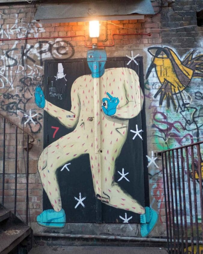 Painting of a blue man over a door