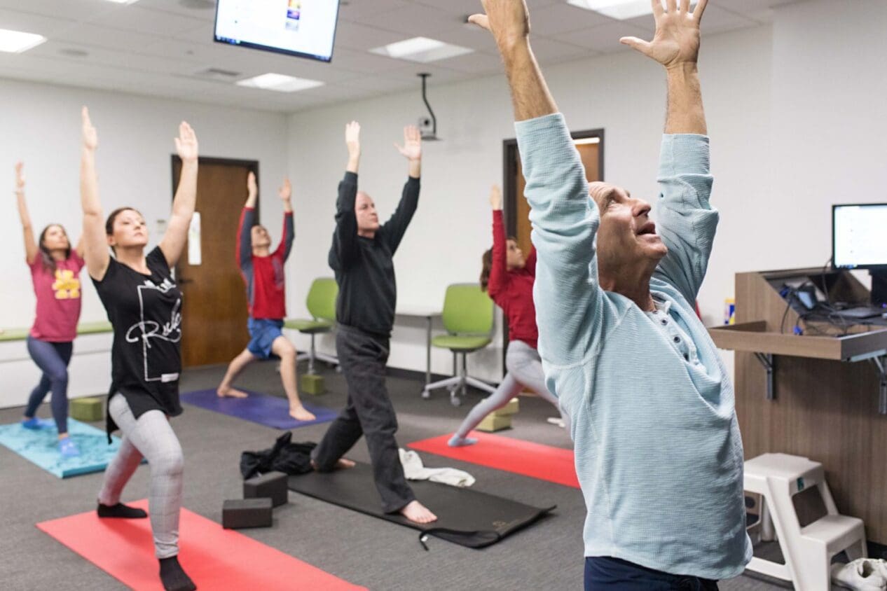 Picture of faculty, students and staff participating in Yoga classes held every Wednesday at the USC Leonard Davis School
