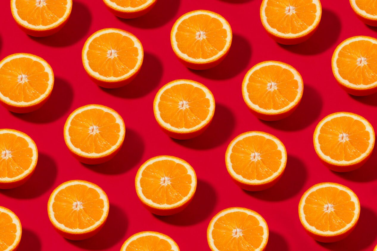 Orange Fruit Pattern on Red Background