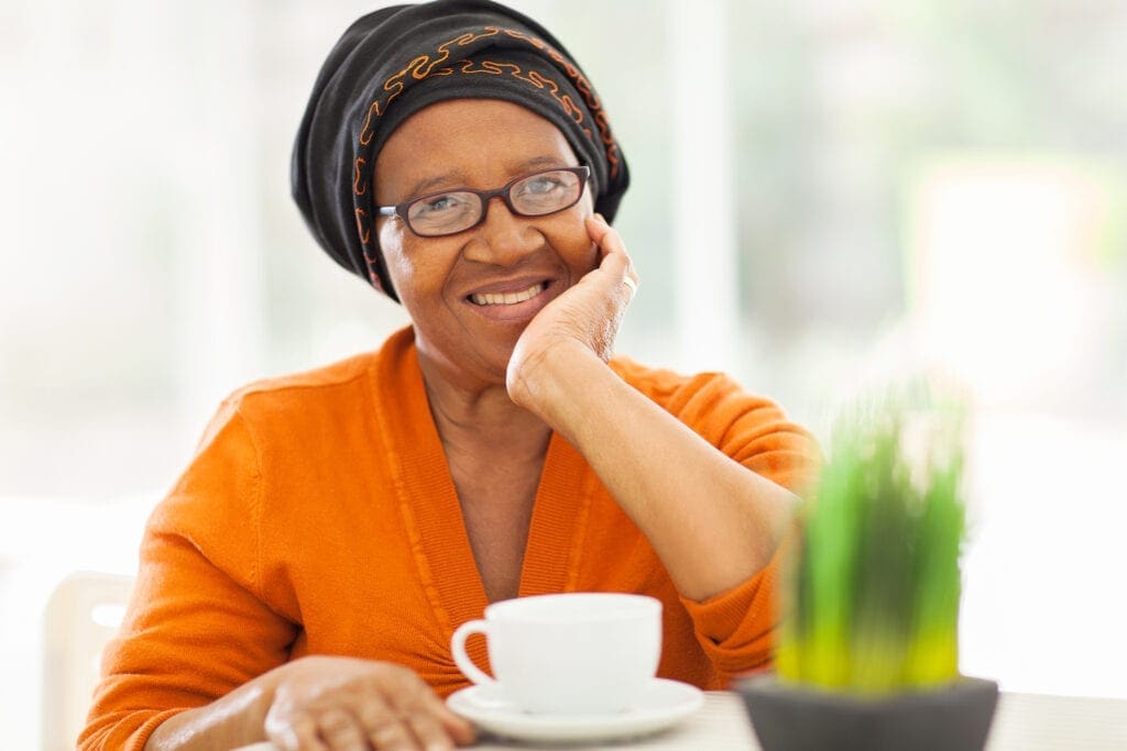 Older Black woman having tea
