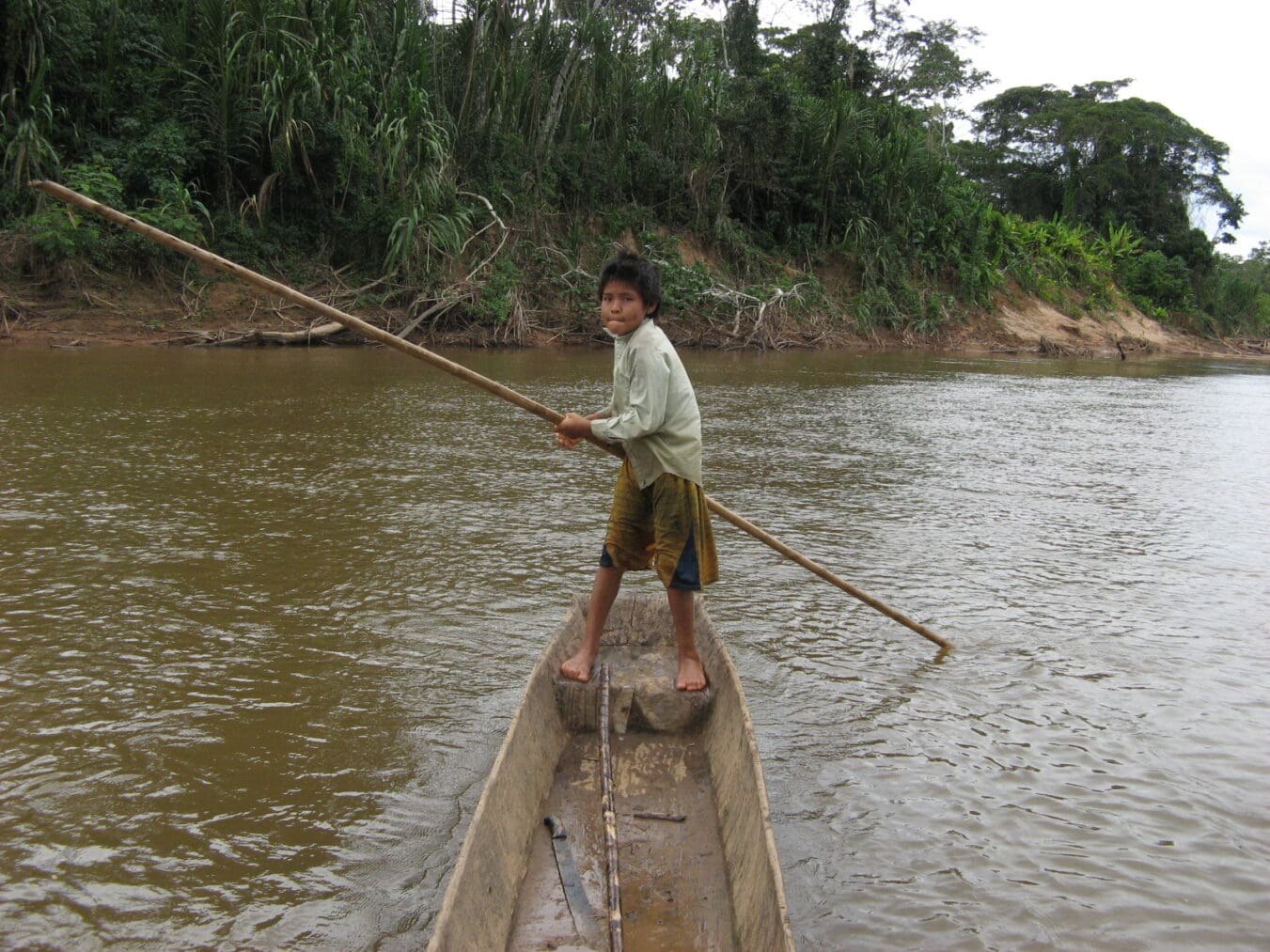 A young member of the Tsimane indigenous group in the Bolivian Amazon in a canoe (photo courtesy Tsimane Health and Life History Project Team)