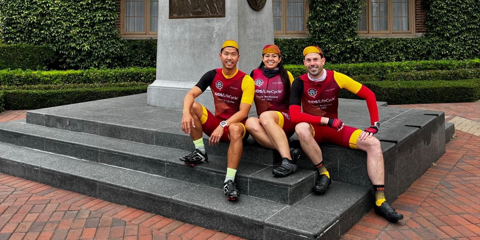 Three people in cycling gear at USC