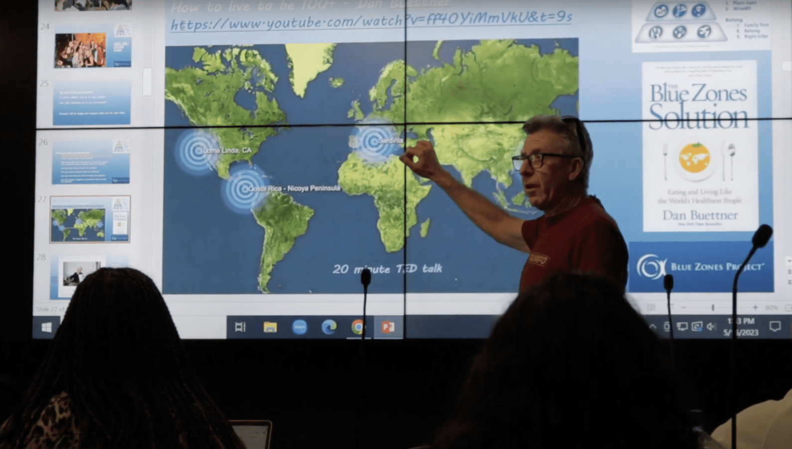 Photo still of John Walsh in the classroom in still from "Riding the Wave" documentary